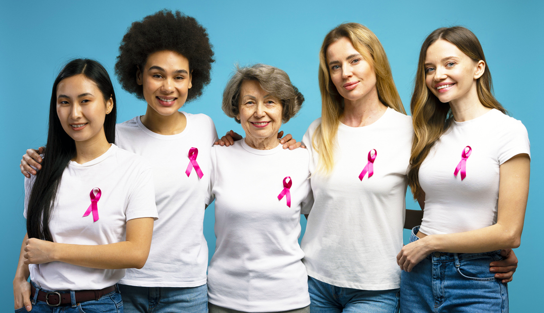 Women wearing pink breast cancer ribbons.